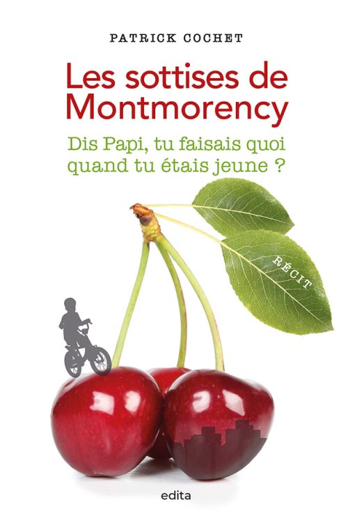 Deux cerises géantes avec un petit garçon qui fait du vélo dessus.